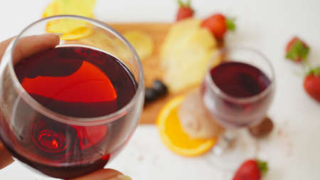 Red wine in a close-up glass. Drinking and cheers emotion.