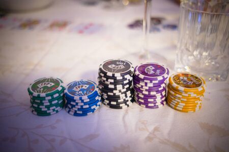 Poker chips laying on a tableの写真素材
