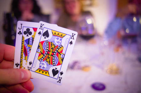 Holding 2 cards in a poker gameのeditorial素材