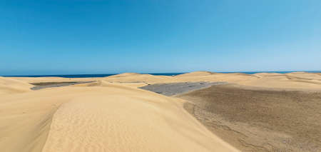 Reddish sand dunes on the island of Gran Canaria.の写真素材