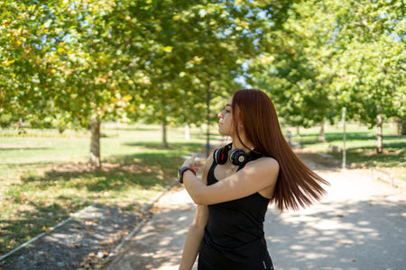 Young woman with photo camera in parkの写真素材