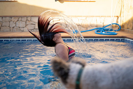 Unrecognizable woman swimming in poolの写真素材
