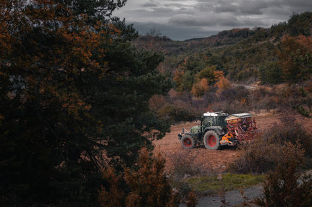 A tractor works in an agricultural field in the Basque Country.の写真素材