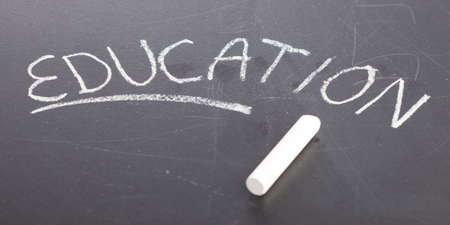 education written with a chalk on a blackboard