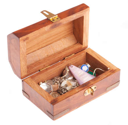 vintage wooden casket  with cheap jewelery on white background