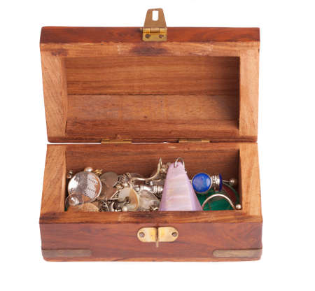 vintage wooden casket  with cheap jewelery on white backgroundの写真素材
