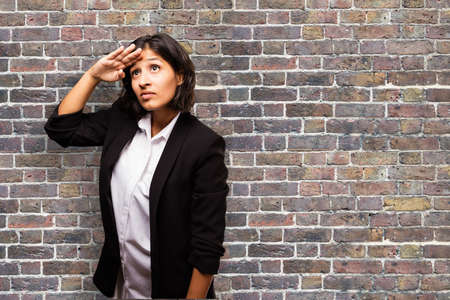 latin business woman looking farの写真素材
