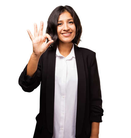 latin business woman doing okay gestureの写真素材