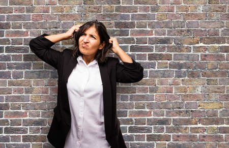 latin business woman stretching her hairの写真素材
