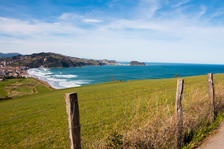 View of Zarautz and Getaria from mount  A roadside fence in foreground の写真素材