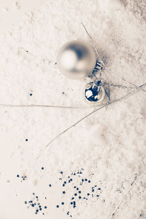 Minimal Christmas decoration with silver  balls, branches, stars and fake snowの写真素材