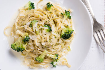 Dish of pasta with broccoli, cheese and pepperの写真素材
