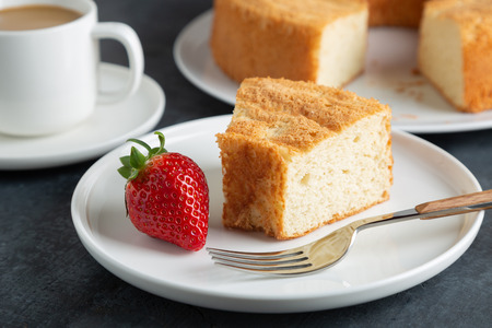 Portion of angel food cake served with strawberriesの写真素材