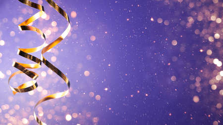 Celebration party background with a golden streamer, glitter, sparks and lights bokehの写真素材