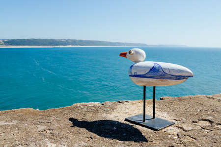 NazarÃ©, Portugal - June 29, 2021: Ceramic seagull belonging to the installation on the fort of San Miguel created by the portuguese artist Mario Reisのeditorial素材