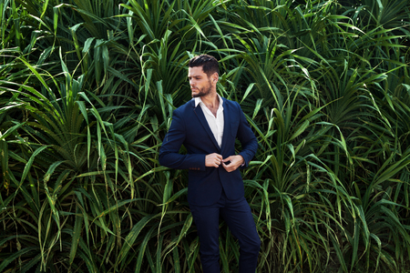 Man in jungle in suiteの写真素材