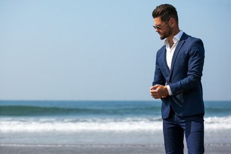 Elegant young handsome man. Outdoors fashion portrait.の写真素材