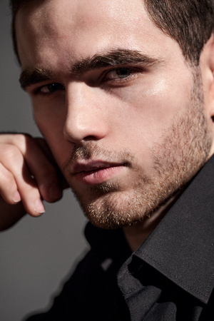 Portrait of a young man with a handsome faceの写真素材