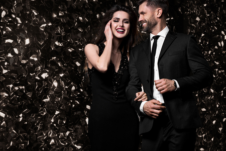 Sexy couple on shine background. Friends on celebrating, party. Hollywood stars.の写真素材