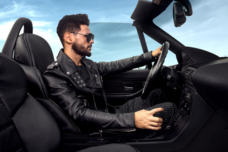 Successful, handsome man in the car.の写真素材