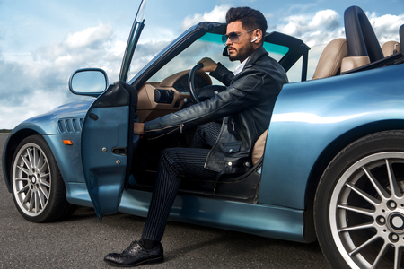 Successful, handsome man in the car.の写真素材