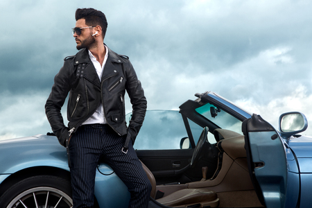 Successful, handsome man near the car.の写真素材