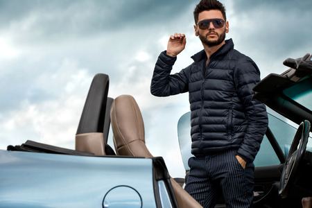 Handsome man near the car.の写真素材