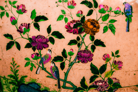 The Tree and Flowers Art paintings on tiles along the galleries of the Temple of the Emerald Buddha, grand palace or wat phra kaew Bangkok Thailandのeditorial素材