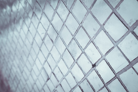 Beautiful closeup textures abstract tiles and silver and white color glass wall background and...