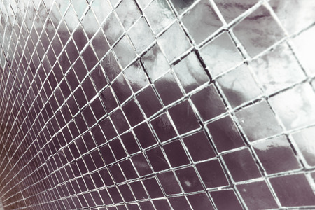 Beautiful closeup textures abstract tiles and light blue and silver glass pieces pattern wall background and art wallpapersの写真素材