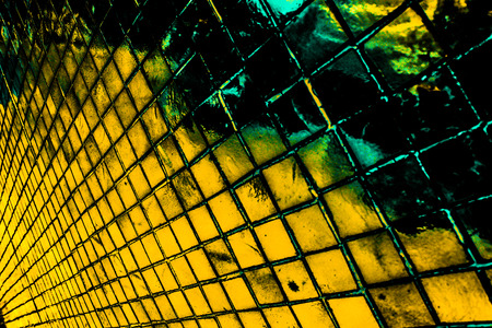 Beautiful closeup textures abstract tiles and black gold and yellow color glass pattern wall background and art wallpaperの写真素材