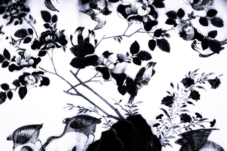 Tree bird and Flowers Art paintings on tiles pattern wall and colorful black and white isolated along the galleries of the Temple of the Emerald Buddha, grand palaceの写真素材