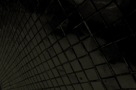 Beautiful closeup textures abstract tiles and dark black color glass pattern wall background and art wallpaperの写真素材