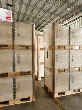 Shipment cartons box on pallets and wooden case on hand lift in interior warehouse cargo for export...
