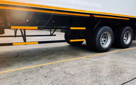 Freight container truck parking at loading dock for load shipment carton boxes and goods from...