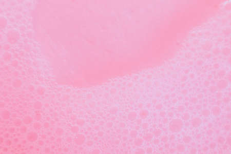 Beautiful pink soap bubbles background, orange and white foam bubble textureの写真素材