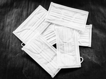 White surgical face mask on black background,  Health care concept and can protect virus covid-19,...
