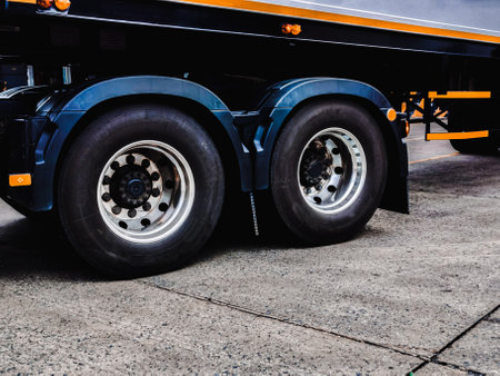 Worker driving forklift loading shipment carton boxes goods on wooden pallet at loading dock from container truck to warehouse cargo storage in freight logistics, transportation industrial, deliveryの写真素材