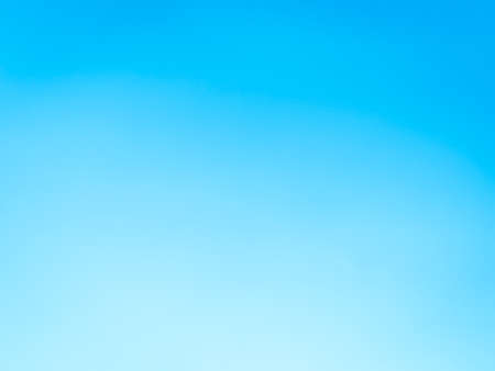 Blue sky background with tiny clouds, soft focus. Abstract natural background.の写真素材