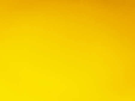 abstract yellow background texture with some smooth highlights and folds in itの写真素材