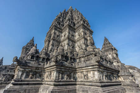 Side view of Candi Siwa (Shiva Temple) in Prambanan temple complex. 9th century Hindu temple compound located near Yogyakarta on Central Java, Indonesiaの写真素材