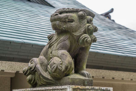Taito-ku, Tokyo - July 27, 2017: Lion-dog Komainu guardians at the entrance of Gojoten jinja shrine. Located in Ueno Park. Dedicated the scholar Sugawara no Michizaneto, enshrines medicine and learning godsのeditorial素材