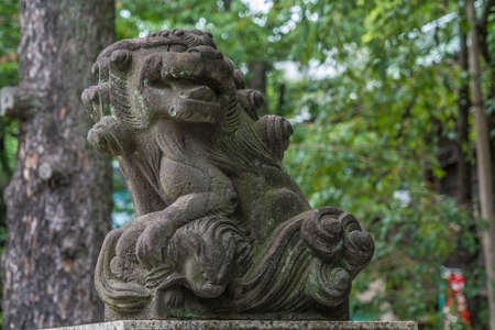 Taito-ku, Tokyo - July 27, 2017: Lion-dog Komainu guardians at the entrance of Gojoten jinja shrine. Located in Ueno Park. Dedicated the scholar Sugawara no Michizaneto, enshrines medicine and learning godsのeditorial素材