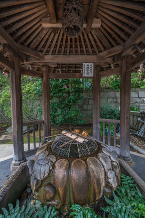 Taito-ku, Tokyo - July 27, 2017: Rare style Temizuya or Chozuya (place o clean hands) at Gojoten...