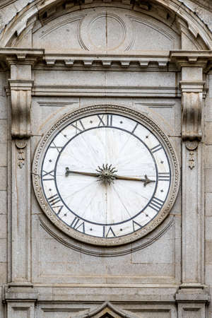 Toledo Cathedral (Catedral de Toledo), north entrance one-handed or Single-handed clock with roman numerals.の写真素材
