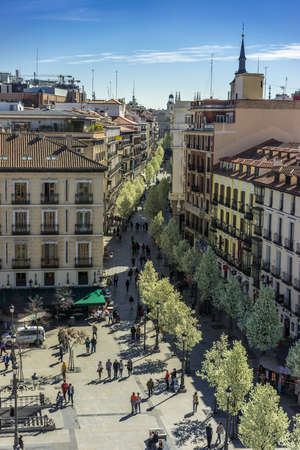 Madrid, Spain. March 20, 2017. Blooming cherry trees from Plaza de Isabel II along Arenal street...
