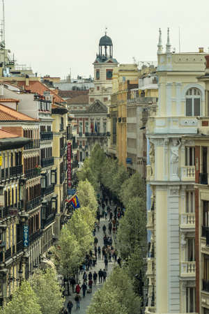 Madrid, Spain. March 21, 2017. Blooming cherry trees from Plaza de Isabel II along Arenal street...
