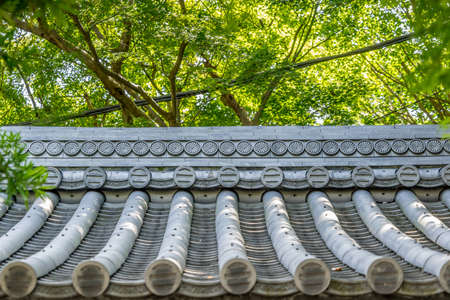 Kamakura, Japan. August 15, 2015. Traditional roof of Hokoku-ji temple from Kencho-ji school of the Rinzai sect of Zen Buddhism. Famous for its bamboo garden, it is also known as "Bamboo Temple"のeditorial素材