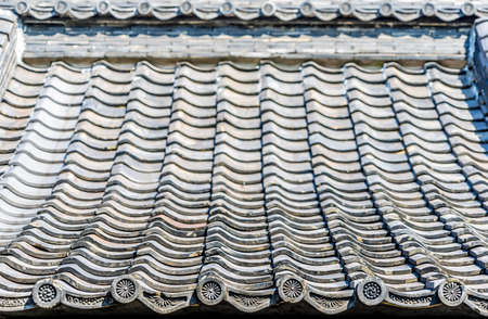 Kamakura, Japan. August 15, 2015. Roof of Tatsumi Jinja Shrine (Tatsumi Kojin) Built in 8th century, it enshrines Okutsuhiko no Kami or Kojin-sama, protector of kitchens and cooking firesのeditorial素材