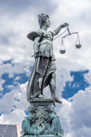 Frankfurt, July 26, 2016. Beautiful tatue at Fountain of Justice (Gerechtigkeitsbrunnen) in Romerberg (Roman Mountain) historic center of the Altstadt (old town), nowdays a popular tourist destination.のeditorial素材